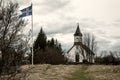 Old Icelandic church and flag tonned image Royalty Free Stock Photo