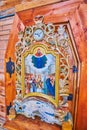 The old icon of Virgin Mary in scenic wooden carved frame, Intercession Church of Zaporizhian Sich scansen, Zaporizhzhia, Ukraine