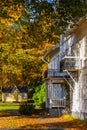 Old idyllic wooden house in a park in autumn