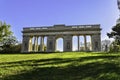 Memorial building of the colonnade at Reistna in the summer on the green grass. Historic monument with a series of columns, South