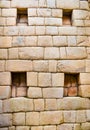 Old inca wall with windows close-up in Machu Picchu ruins Royalty Free Stock Photo