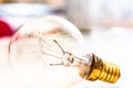 Old Incandescent light glass bulb, provides light by passing an electric current through a filament