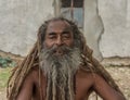 Old indian baba man with threadlike hair