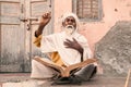 Old indian sadhu speak up sacred scriptures. Royalty Free Stock Photo