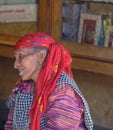 Old Indian woman in a red shawl