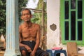 Old Indonesian man on porch of his house in a village in Java