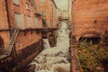 Old industrial area with factories and wWater stream of a small waterfall in Gothenburg, Sweden Royalty Free Stock Photo