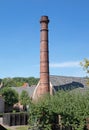 Old industrial brick chimney, blue sky Royalty Free Stock Photo