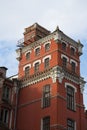 Old Industrial building of the factory from red brick with white trim, outside view, against blue sky, Vertical Royalty Free Stock Photo