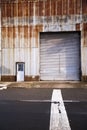 Old industrial building with rusty shell and big gate Royalty Free Stock Photo
