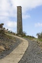 The old industrial chimney from the 19th century South Engine House at the derelict lead mines workings in Conlig in County Down, Royalty Free Stock Photo