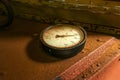 Old industrial circular thermometer gauge