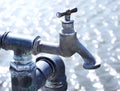 Old industrial faucet with water Royalty Free Stock Photo