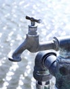 Old industrial faucet with water Royalty Free Stock Photo