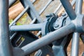 Old industrial gear wheel made of blue iron, along river water works Royalty Free Stock Photo