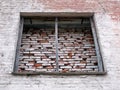 Old industrial loft building wall with big boarded up window Royalty Free Stock Photo