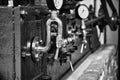 Black and white Old Industrial Machine pressure gauge and pipes