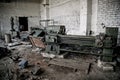 Old industrial machine tools and rusty metal equipment in abandoned factory Royalty Free Stock Photo