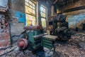 Old industrial machine tools in workshop. Rusty metal equipment in abandoned factory Royalty Free Stock Photo