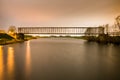 Old industrial railway railroad iron bridge center perspective o Royalty Free Stock Photo