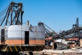 Old industrial ship boat in dry dock for repair, harbor in Greece, sunny day Royalty Free Stock Photo