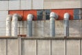 Old industry plant with pipes and tubes. Outside view of manufacturing complex under blue cloud sky. Concrete walls, metal frames Royalty Free Stock Photo