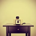 Old instant camera on a bureau