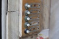 Old intercom buttons on building facade