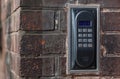 Old intercom on a red brick wall Royalty Free Stock Photo