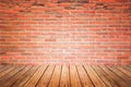 Old interior room with brick wall and wood floor Royalty Free Stock Photo