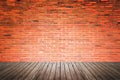 Old interior room with brick wall and wood floor Royalty Free Stock Photo