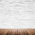 Old interior room with brick wall and wood floor Royalty Free Stock Photo