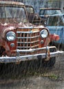 An Old Rusting Red Car in the Rain Royalty Free Stock Photo
