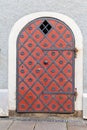 Old ion door, richly decorated outside, close-up