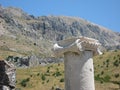 Old ionic column and mountains as a background Royalty Free Stock Photo