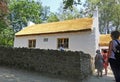 Old Irish Traditional Whitewashed Cottage with a thatched roof at The Ulster America Folk Park Northern Ireland