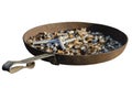 An old iron ashtray full of cigarette butts. Isolate on a white background Royalty Free Stock Photo