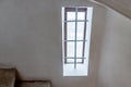 Old iron-barred window ancient medieval castle with white wall copy spase Royalty Free Stock Photo