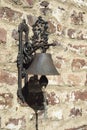 Old iron bell placed on a brick wall Royalty Free Stock Photo