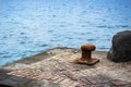 Old iron bollard near Atlantic ocean Royalty Free Stock Photo
