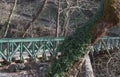 Old iron bridge in the forest mediterranean vegetation Royalty Free Stock Photo