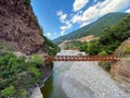 Old iron bridge in Karvasaras with mountains in the background. Royalty Free Stock Photo