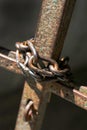 Old iron chain that closes a rusty metal gate Royalty Free Stock Photo