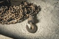 an old iron chain hoist with chain. a large hook for lifting loads Royalty Free Stock Photo