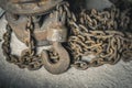 an old iron chain hoist with chain. a large hook for lifting loads Royalty Free Stock Photo