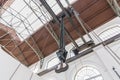 crane hook for overhead crane in old factory. Industrial Chain Hoist with hook hanging on reel. Bottom view inside of the hangar Royalty Free Stock Photo