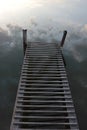 River Landscape Of Old Iron Dock Looks Like A Ladder To Clouds. Stairway To Heaven Concept.