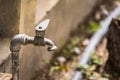 Old iron faucet in the park