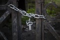 old iron gate closed with chain and padlock Royalty Free Stock Photo