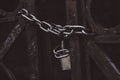 old iron gate closed with chain and padlock Royalty Free Stock Photo